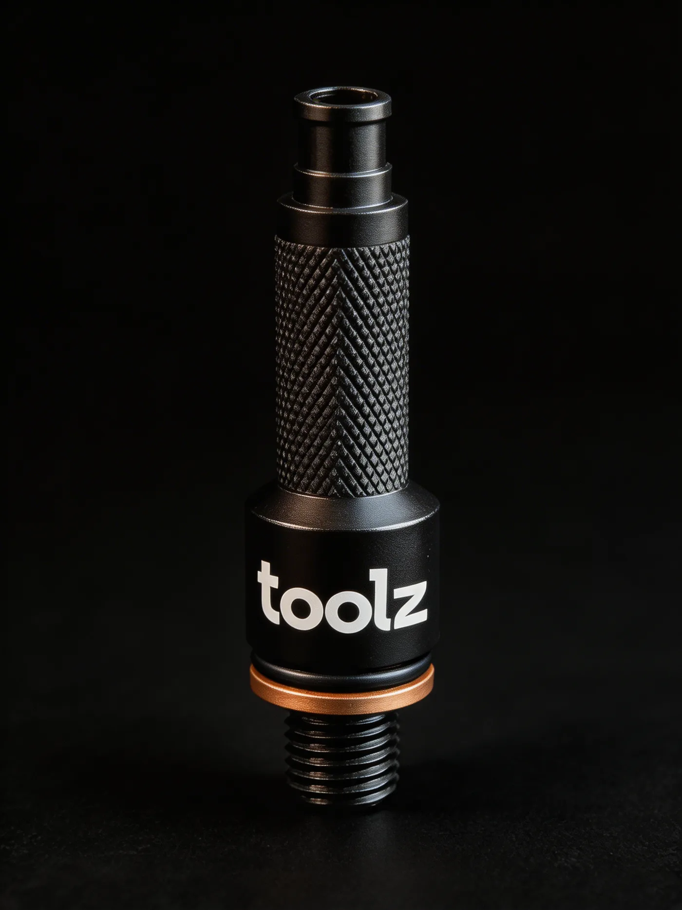 The black Toolz Oil Drain Tool standing upright